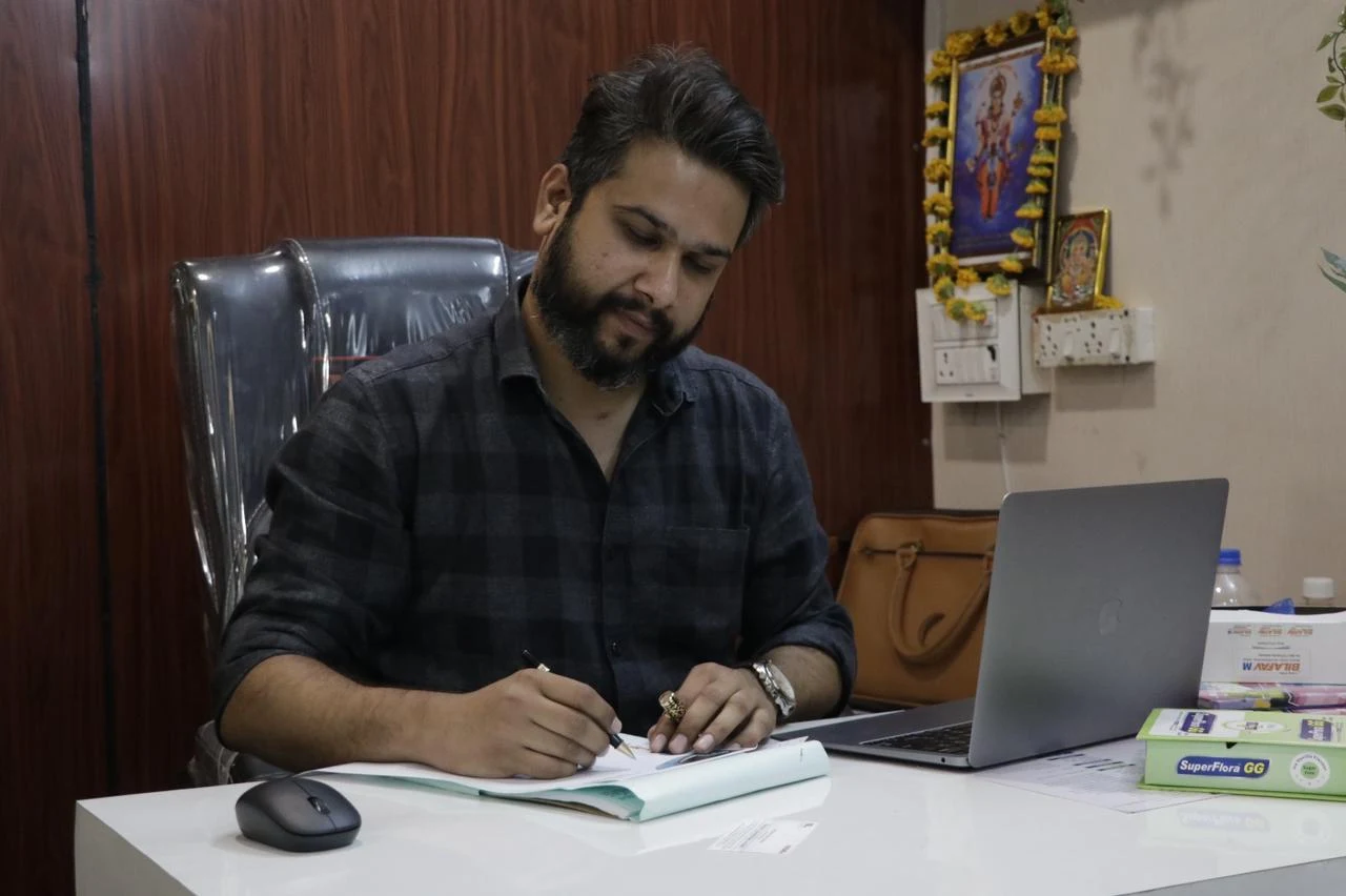 Dr. Nikhil Gupta reviewing clinical notes